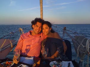 Couple on the bow at sunset